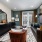 A living room with patio doors to balcony at The Signal apartments in Raleigh.