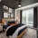 Bedroom with large windows with 2inch binds and overhead ceiling fan
