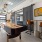 Shuffleboard table with large garage door overlooking city