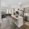 A8 Floorplan kitchen with chef's island, stainless countertops and spacious windows