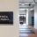 Yoga Studio sign with yoga room with wood flooring and large windows
